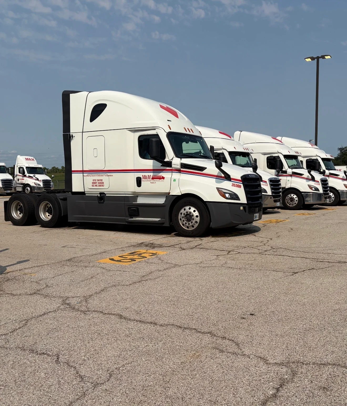 Big Joe's commercial fleet washing - white and red trucks cleaned at Kansas City facility